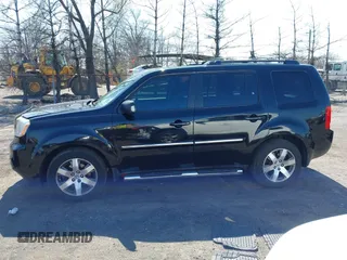 2014 Honda Pilot Touring with VIN 5FNYF4H94EB049495, listed as a IAAI auction lot 41937134 with 149,445 mi miles and . Bid and sale history available at carsss.com. Image 14.