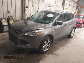 2014 Ford Escape SE with VIN 1FMCU9G95EUE19998, listed as a IAAI auction lot 42217195 with 163,934 mi miles and . Bid and sale history available at DreamBid. Image 2.