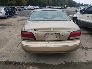 1998 Mazda 626 DX with VIN 1YVGF22C1W5762498, listed as a Copart auction lot 78283944 with 210,639 mi miles and Salvage Title. Bid and sale history available at carsss.com. Image 6.