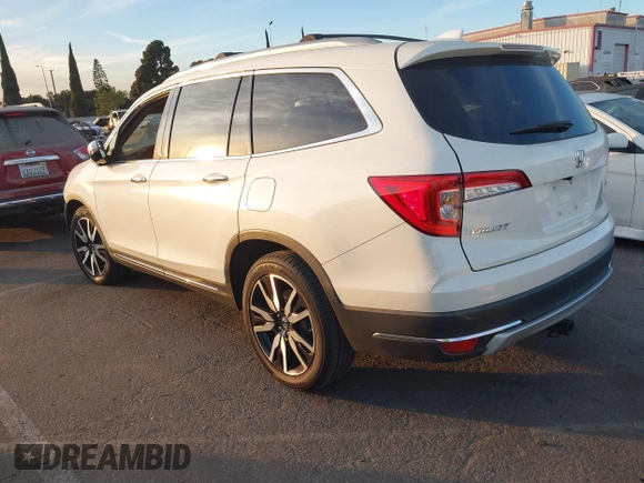 2019 Honda Pilot Touring 8-Passenger with VIN 5FNYF5H97KB005203, listed as a IAAI auction lot 41399930 with 47,267 mi miles and . Bid and sale history available at DreamBid. Image 3.