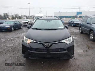 2018 Toyota RAV4 LE with VIN 2T3BFREV2JW788700, listed as a IAAI auction lot 41986212 with 87,704 mi miles. Bid and sale history available at carsss.com. Image 11.