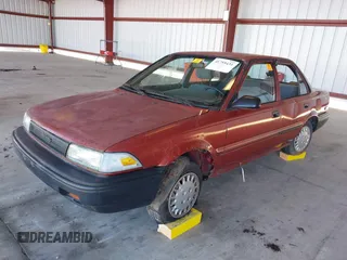 1990 Toyota Corolla z VIN 1NXAE94A1LZ117401, wystawiony jako IAAI lot #41755431 z przebiegiem 81 786 mil mil oraz . Historia ofert i sprzedaży dostępna na DreamBid. Obrazek 2.