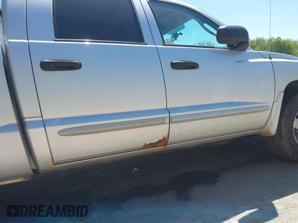 2005 Dodge Dakota SLT with VIN 1D7HW48N45S321002, listed as a IAAI auction lot 42240338 with 214,983 mi miles and . Bid and sale history available at DreamBid. Image 22.