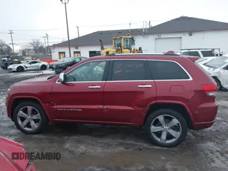 2014 Jeep Grand Cherokee Overland with VIN 1C4RJFCG9EC299235, listed as a IAAI auction lot 41670065 with 108,589 mi miles and . Bid and sale history available at DreamBid. Image 14.