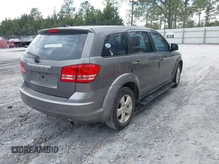 2013 Dodge Journey SE z VIN 3C4PDCAB2DT577805, wystawiony jako IAAI lot #41674351 z przebiegiem 183 006 mil mil oraz . Historia ofert i sprzedaży dostępna na DreamBid. Obrazek 4.