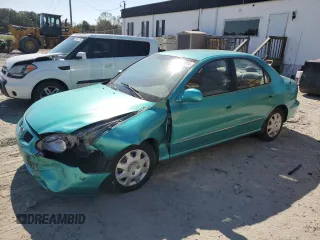 2000 Hyundai Elantra GLS z VIN KMHJF35FXYU998689, wystawiony jako Copart lot #76181814 z przebiegiem 154 743 mil mil oraz Szkoda całkowita • Salvage title. Historia ofert i sprzedaży dostępna na DreamBid. Obrazek 1.
