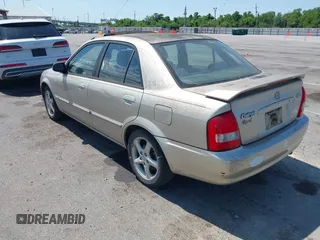 2002 Mazda Protege DX with VIN JM1BJ225820568350, listed as a IAAI auction lot 42188364 with 52,572 mi miles and . Bid and sale history available at DreamBid. Image 3.