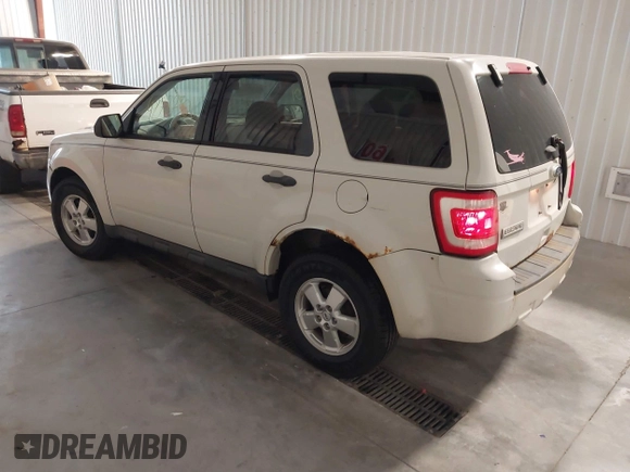 2011 Ford Escape XLS with VIN 1FMCU9C7XBKA40863, listed as a IAAI auction lot 42777301 with 219,848 mi miles and . Bid and sale history available at DreamBid. Image 3.