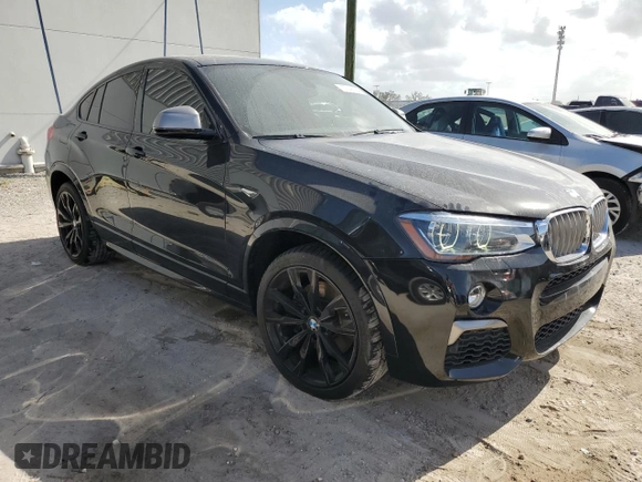 2017 BMW X4 M40i with VIN 5UXXW7C51H0U25766, listed as a Copart auction lot 77749324 with 101,289 mi miles and Salvage Title. Bid and sale history available at carsss.com. Image 4.