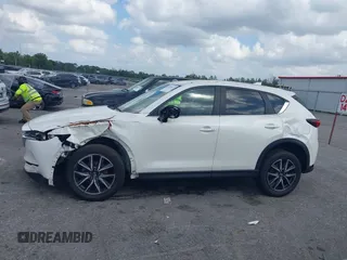 2018 Mazda CX-5 Touring z VIN JM3KFACM6J1419663, wystawiony jako IAAI lot #41879677 z przebiegiem 115 224 mil mil oraz . Historia ofert i sprzedaży dostępna na DreamBid. Obrazek 14.