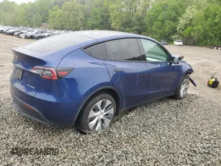 2022 Tesla Model Y Long Range z VIN 7SAYGDEE6NF318808, wystawiony jako Copart lot #57219915 z przebiegiem Nie podano mil oraz Szkoda całkowita • Salvage title. Historia ofert i sprzedaży dostępna na DreamBid. Obrazek 3.