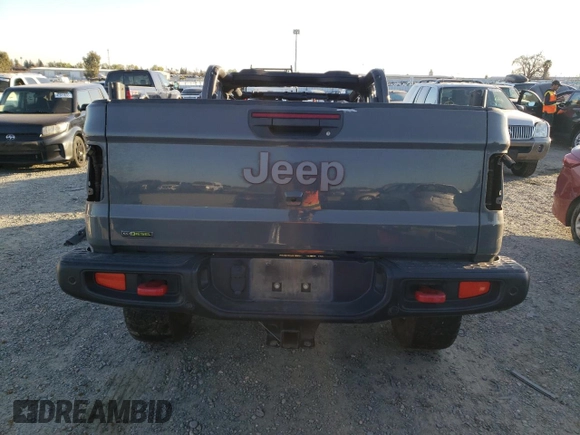 2021 Jeep Gladiator Rubicon z VIN 1C6JJTBMXML503128, wystawiony jako Copart lot #42813725 z przebiegiem Nie podano mil oraz Szkoda całkowita • Salvage title. Historia ofert i sprzedaży dostępna na DreamBid. Obrazek 6.