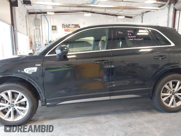 2021 Audi Q3 S line Premium Plus with VIN WA1EECF32M1054629, listed as a IAAI auction lot 41588322 with 33,385 mi miles and . Bid and sale history available at DreamBid. Image 15.