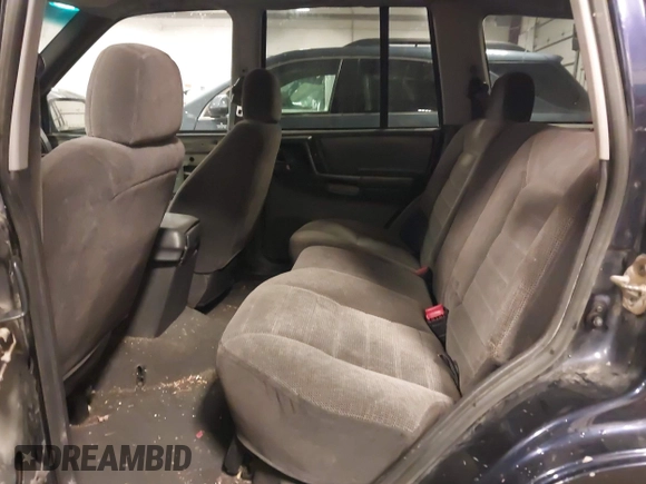1997 Jeep Grand Cherokee Laredo with VIN 1J4GZ58S8VC675487, listed as a IAAI auction lot 41034046 with 243,284 mi miles. Bid and sale history available at carsss.com. Image 8.