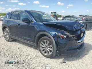 2021 Mazda CX-5 Grand Touring with VIN JM3KFADM1M0301366, listed as a Copart auction lot 52890955 with 66,686 mi miles and Non Repairable. Bid and sale history available at carsss.com. Image 4.