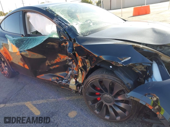 2022 Tesla Model Y Performance with VIN 7SAYGDEF5NF336693, listed as a IAAI auction lot 41805752 with 42,009 mi miles and . Bid and sale history available at DreamBid. Image 6.
