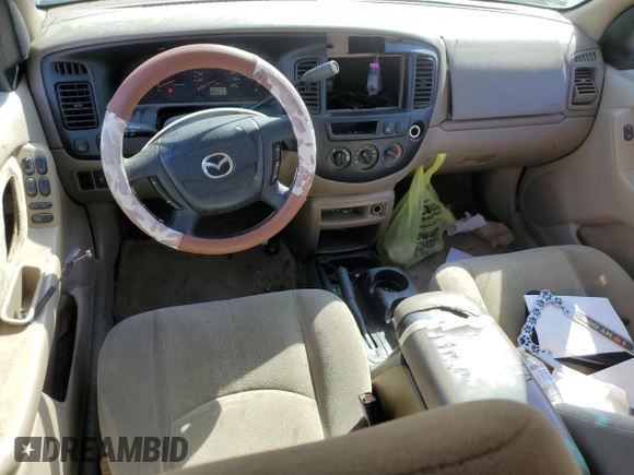 2002 Mazda Tribute LX with VIN 4F2YU09122KM62196, listed as a Copart auction lot 77327034 with 256,385 mi miles and Salvage Title. Bid and sale history available at carsss.com. Image 8.