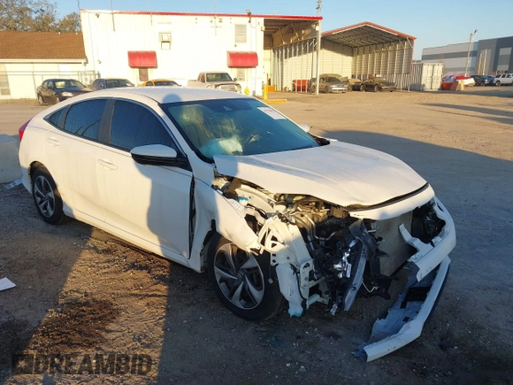 2019 Honda Civic LX with VIN 19XFC2F61KE014007, listed as a IAAI auction lot 41795070 with 64,259 mi miles and . Bid and sale history available at DreamBid. Image 1.
