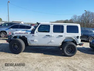 2022 Jeep Wrangler Unlimited Rubicon z VIN 1C4JJXFGXNW121489, wystawiony jako IAAI lot #41749550 z przebiegiem 56 601 mil mil oraz . Historia ofert i sprzedaży dostępna na DreamBid. Obrazek 6.