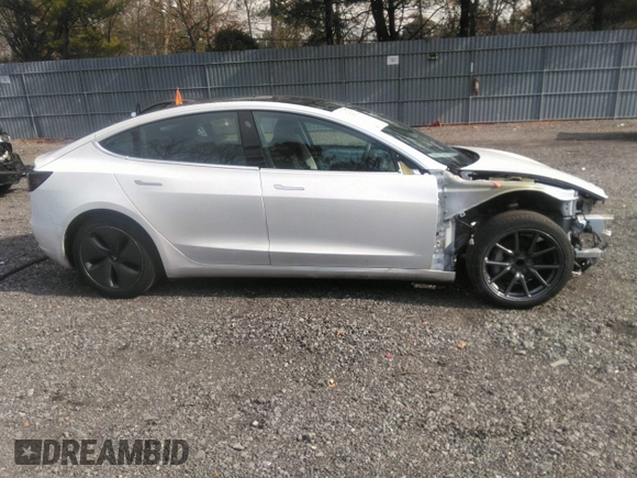 2020 Tesla Model 3 Standard Range Plus with VIN 5YJ3E1EA4LF792830, listed as a IAAI auction lot 41852919 with 76,461 mi miles. Bid and sale history available at carsss.com. Image 13.