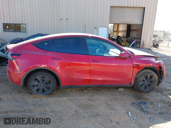 2023 Tesla Model Y Long Range with VIN 7SAYGDEE8PF709459, listed as a IAAI auction lot 41334108 with 51,544 mi miles. Bid and sale history available at carsss.com. Image 12.