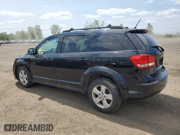 2013 Dodge Journey SE with VIN 3C4PDCAB0DT500365, listed as a Copart auction lot 61033665 with 193,231 mi miles and Salvage title. Bid and sale history available at DreamBid. Image 2.