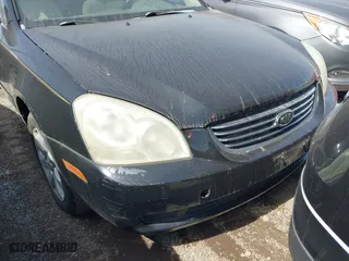 2007 Kia Optima LX with VIN KNAGE124975133923, listed as a IAAI auction lot 42007990 with 87,768 mi miles. Bid and sale history available at carsss.com. Image 6.