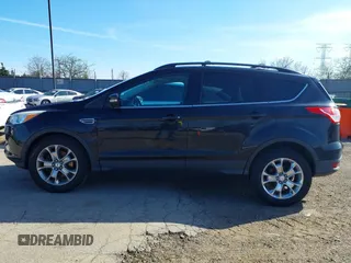 2013 Ford Escape SEL with VIN 1FMCU9HX1DUA20307, listed as a IAAI auction lot 41933873 with 164,962 mi miles. Bid and sale history available at carsss.com. Image 13.