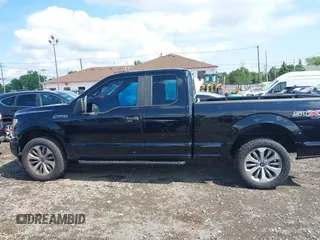 2018 Ford F-150 XL with VIN 1FTEX1EP5JKG01004, listed as a IAAI auction lot 42583232 with 123,258 mi miles and . Bid and sale history available at DreamBid. Image 14.