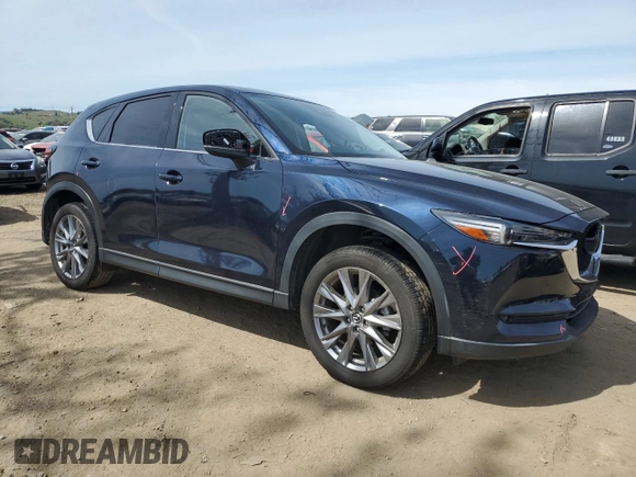 2021 Mazda CX-5 Grand Touring with VIN JM3KFBDM2M0494679, listed as a Copart auction lot 50017675 with 25,965 mi miles and Salvage Title. Bid and sale history available at carsss.com. Image 4.
