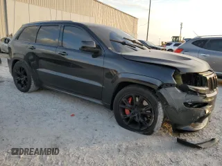 2012 Jeep Grand Cherokee SRT8 with VIN 1C4RJFDJ2CC329621, listed as a Copart auction lot 86772154 with 236,800 mi miles and Salvage Title. Bid and sale history available at carsss.com. Image 4.