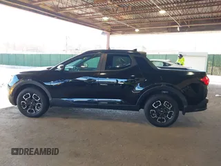 2022 Hyundai Santa Cruz SEL z VIN 5NTJCDAE7NH018858, wystawiony jako IAAI lot #42038182 z przebiegiem 28 596 mil mil oraz . Historia ofert i sprzedaży dostępna na DreamBid. Obrazek 15.