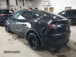 2023 Tesla Model Y Long Range with VIN 7SAYGDEE2PF808844, listed as a IAAI auction lot 41941905 with 39,951 mi miles and . Bid and sale history available at carsss.com. Image 3.