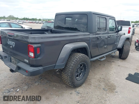 2020 Jeep Gladiator Overland with VIN 1C6HJTFG8LL166086, listed as a IAAI auction lot 42016222 with 102,232 mi miles and . Bid and sale history available at DreamBid. Image 4.