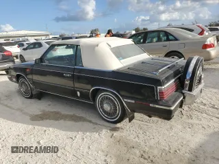 1985 Chrysler LeBaron Mark Cross z VIN 1C3BC55E0FG160918, wystawiony jako Copart lot #76659284 z przebiegiem Nie podano mil oraz Szkody całkowita. Historia ofert i sprzedaży dostępna na DreamBid. Obrazek 2.