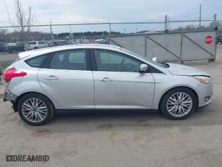 2015 Ford Focus Titanium with VIN 1FADP3N27FL228549, listed as a IAAI auction lot 41912941 with 69,025 mi miles. Bid and sale history available at carsss.com. Image 13.