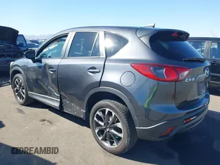 2016 Mazda CX-5 Grand Touring z VIN JM3KE2DYXG0649781, wystawiony jako IAAI lot #41636329 z przebiegiem 83 433 mil mil oraz . Historia ofert i sprzedaży dostępna na DreamBid. Obrazek 3.