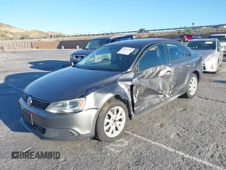 2012 Volkswagen Jetta Sedan SE w/Convenience with VIN 3VWDX7AJ7CM412976, listed as a IAAI auction lot 41823799 with 210,248 mi miles. Bid and sale history available at carsss.com. Image 2.
