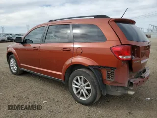 2013 Dodge Journey SXT with VIN 3C4PDCBG9DT710666, listed as a Copart auction lot 86851234 with 165,171 mi miles and Salvage title. Bid and sale history available at DreamBid. Image 2.