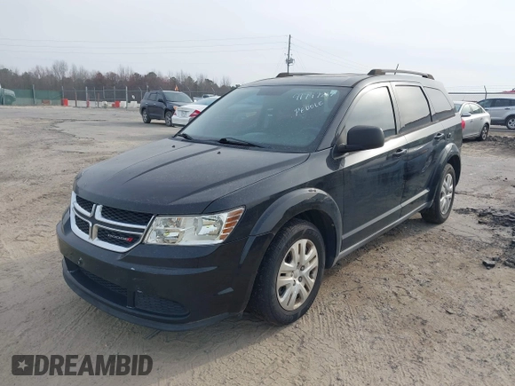 2013 Dodge Journey SE with VIN 3C4PDCAB0DT702977, listed as a IAAI auction lot 41797817 with 150,317 mi miles. Bid and sale history available at carsss.com. Image 2.
