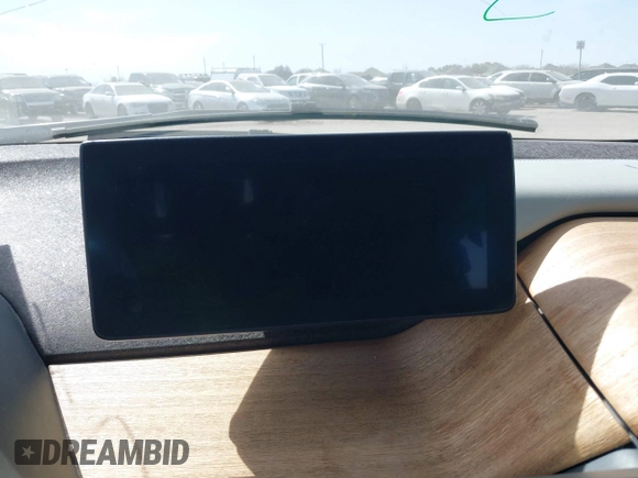2015 BMW i3 z VIN WBY1Z2C51FV286397, wystawiony jako IAAI lot #41729019 z przebiegiem Nie podano mil oraz . Historia ofert i sprzedaży dostępna na DreamBid. Obrazek 14.