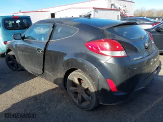 2015 Hyundai Veloster with VIN KMHTC6AD0FU245001, listed as a IAAI auction lot 41881391 with 119,873 mi miles. Bid and sale history available at carsss.com. Image 3.