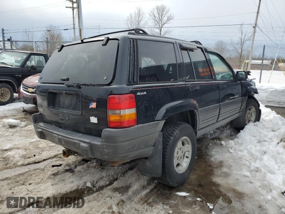1998 Jeep Grand Cherokee Laredo with VIN 1J4GZ58SXWC293835, listed as a Copart auction lot 47557855 with 217,948 mi miles and Salvage Title. Bid and sale history available at carsss.com. Image 3.
