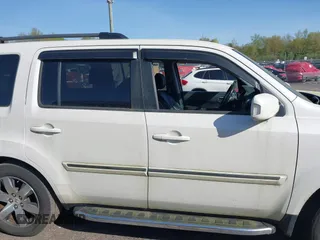 2013 Honda Pilot Touring with VIN 5FNYF4H97DB069979, listed as a IAAI auction lot 42133922 with 276,574 mi miles and . Bid and sale history available at carsss.com. Image 13.