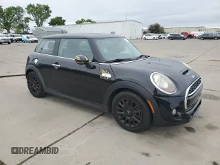 2014 MINI Hardtop S with VIN WMWXM7C57ET987069, listed as a Copart auction lot 52147955 with 121,276 mi miles and Salvage Title. Bid and sale history available at DreamBid. Image 4.