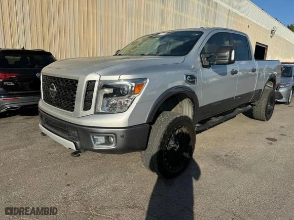 2016 Nissan Titan XD PRO-4X with VIN 1N6BA1F46GN507954, listed as a Copart auction lot 77952834 with 140571 miles and Clean Title. Bid and sale history available at carsss.com. Image 2.