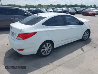 2014 Hyundai Accent GLS with VIN KMHCU4AE6EU766796, listed as a IAAI auction lot 41933743 with 99,142 mi miles. Bid and sale history available at carsss.com. Image 4.