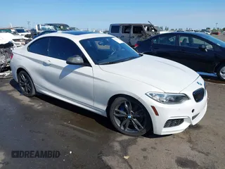 2016 BMW 2 Series M235i with VIN WBA1J7C5XGV359562, listed as a IAAI auction lot 39990299 with 54,022 mi miles. Bid and sale history available at carsss.com. Image 1.