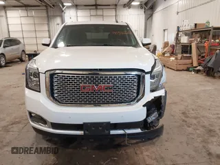 2015 GMC Yukon SLE with VIN 1GKS2AKC6FR103447, listed as a IAAI auction lot 41596220 with 104,209 mi miles. Bid and sale history available at carsss.com. Image 12.