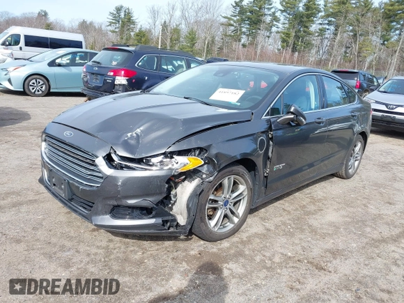 2015 Ford Fusion Energi Titanium with VIN 3FA6P0SU0FR200963, listed as a IAAI auction lot 41897182 with 104,100 mi miles. Bid and sale history available at carsss.com. Image 2.